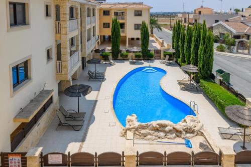 an overhead view of a swimming pool in a hotel at Blue Serenity Complex in Larnaka