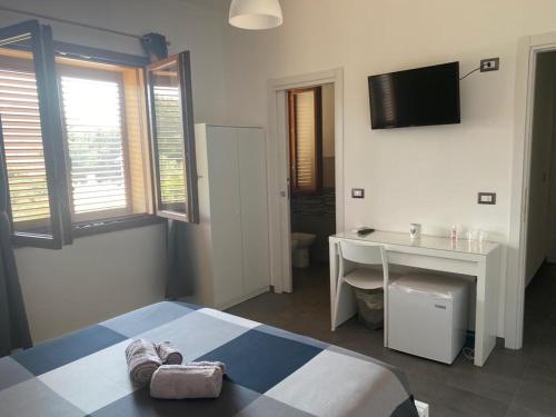 Postel nebo postele na pokoji v ubytování B&B Il Sogno di Mario
