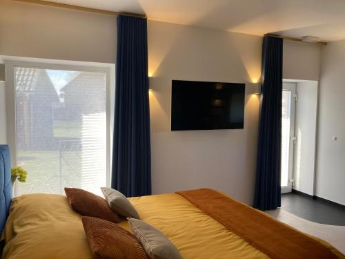 TV a/nebo společenská místnost v ubytování B&B Ferienhof AB Wellness Suite