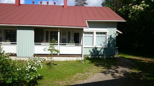 a small house with a red roof at Kotareitti Apartments in Rovaniemi
