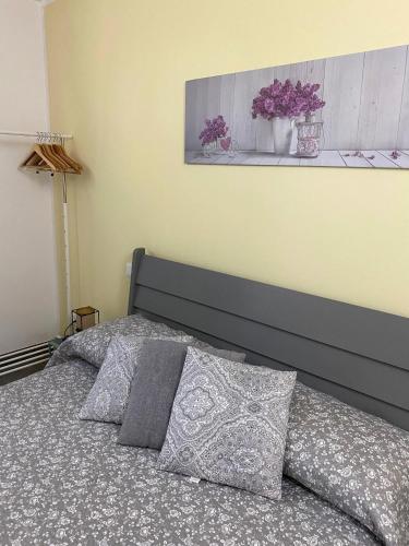 a bedroom with a bed with two pillows at B&B Sole in Ravenna