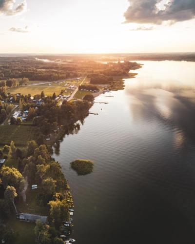 an aerial view of a river with trees and houses at Jarzębinowa - Dom do wynajęcia na Podlasiu in Łuka