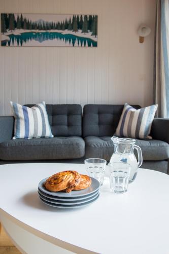 a table with plates of food on top of it at Stunning renovated studio with mezzanine in Morzine