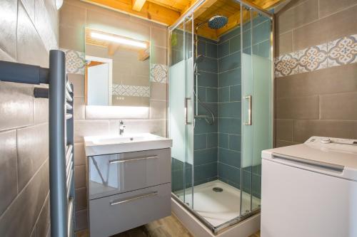 a bathroom with a shower and a sink and a toilet at Stunning renovated studio with mezzanine in Morzine