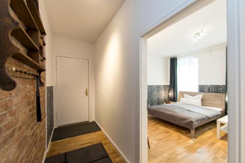 a bedroom with a bed and a window at Sleep Like Home Winsviertel in Berlin