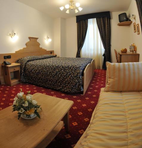 Postel nebo postele na pokoji v ubytování Hotel Il Maniero