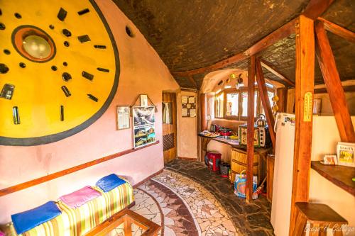 a room with a play room with a clock on the wall at Alojamiento Ecológico Kurache in Tandil