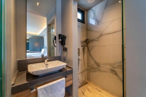 a bathroom with a sink and a mirror at S3 Seahorse Beach Club in Oludeniz