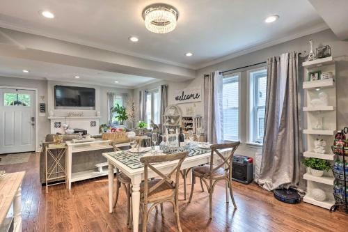 a kitchen and dining room with a table and chairs at Outdoor Pool and Hot Tub Retreat - 6 Mi to Dtwn! in Baltimore