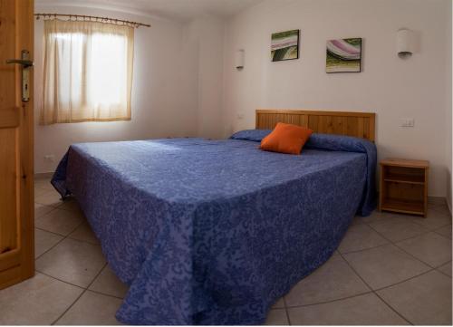 Säng eller sängar i ett rum på Villette Oleandri Vista Mare