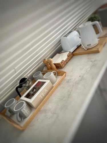 a shelf with various items on it on a table at Szőlőhegy Vendégház Sümeg in Sümeg