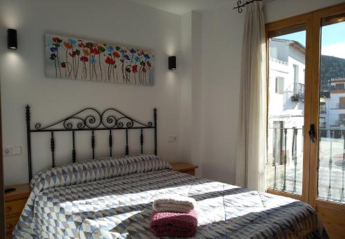 a bedroom with a bed with two pillows on it at La Casa del Carrebaix in Orba