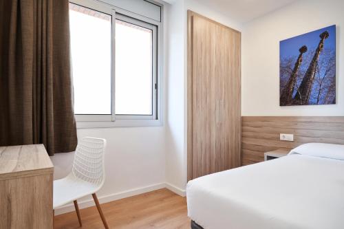 Кровать или кровати в номере Aparthotel Augusta