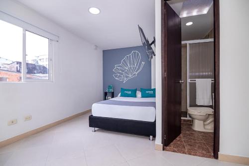 Ένα ή περισσότερα κρεβάτια σε δωμάτιο στο Ayenda DAM