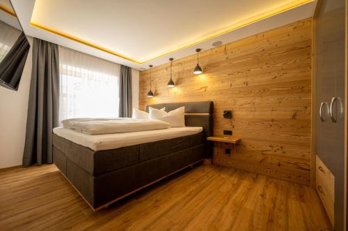 Ένα ή περισσότερα κρεβάτια σε δωμάτιο στο Apart Walser