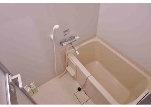 a bathroom with a bath tub in a room at Marvelous Kokubunji - Vacation STAY 41073v in Kokubunji