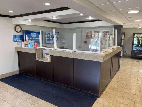 a cashier counter in a waiting area of a store at Studio 6 Peoria IL in Peoria