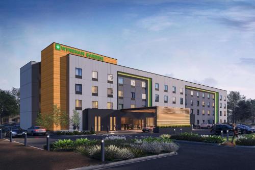 a rendering of a hotel with a parking lot at Wyndham Garden Orlando Airport in Orlando