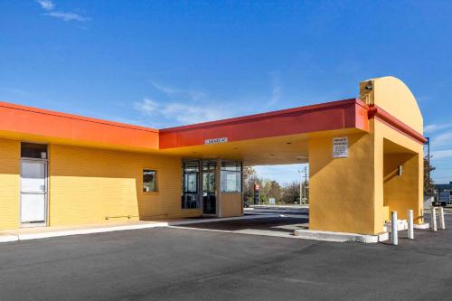 a yellow and orange building with a parking lot at Econo Lodge Gaffney in Gaffney