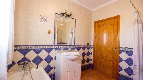 a bathroom with a toilet and a sink and a tub at Casa Tejo Sedella by Ruralidays in Sedella