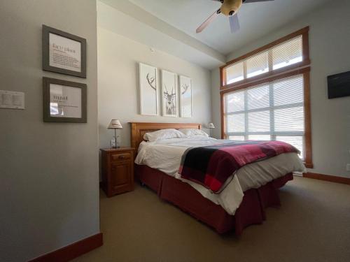 a bedroom with a bed and a ceiling fan at Panorama Springs in Panorama