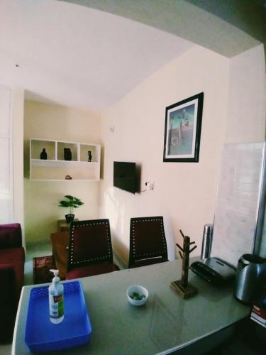 a living room with a table and two chairs at Ocean View Nyali Boutique Hotel in Nyali