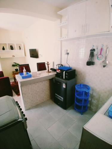 a kitchen with a counter and a sink in it at Ocean View Nyali Boutique Hotel in Nyali