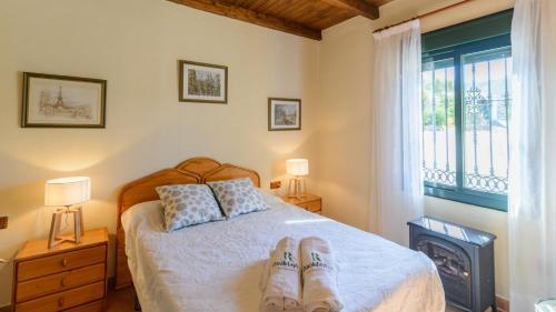 A bed or beds in a room at Finca El Mirador Malaga by Ruralidays
