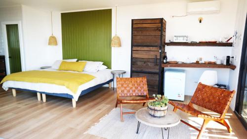 Una cama o camas en una habitación de Palcos de Apalta