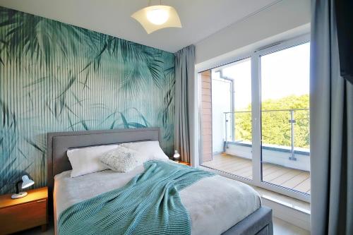 Katil atau katil-katil dalam bilik di SPA Nadmorskie Tarasy Nemo Apartamenty Kołobrzeg - Latarnia morska - Port