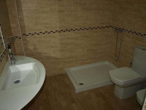 a bathroom with a sink and a toilet and a shower at San Antón in Cazorla