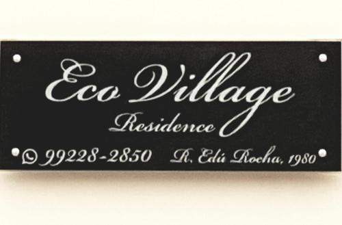 a sign that reads ac village residence in white handwriting at Sobrado 2 amplo e confortável em condomínio in Corumbá