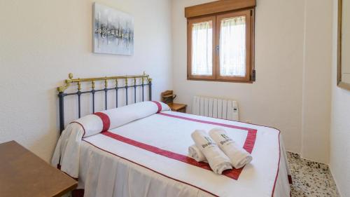 מיטה או מיטות בחדר ב-Casita De Rufo Cenes de la Vega by Ruralidays