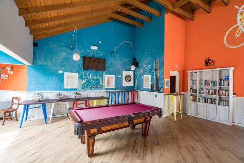 a room with a ping pong table in it at Bed & Bike Curacao - Jan Thiel in Willemstad