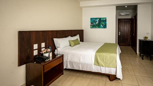 Кровать или кровати в номере Imperla Hotel