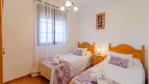 Posteľ alebo postele v izbe v ubytovaní Casa El Mirador Iznajar by Ruralidays