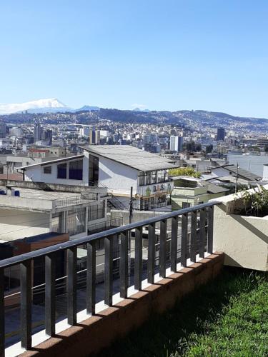 a view of a city from a balcony at Casa de Tulia in Quito