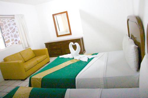 Postel nebo postele na pokoji v ubytování Hotel Ameyali Tequesquitengo