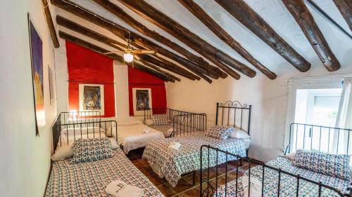 Ліжко або ліжка в номері Cortijo La Vega Archidona by Ruralidays