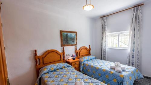 Posteľ alebo postele v izbe v ubytovaní Casa Leo Frigiliana by Ruralidays