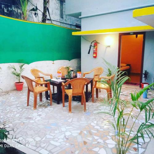 a group of chairs and a table in a patio at Paradise corner in Pondicherry