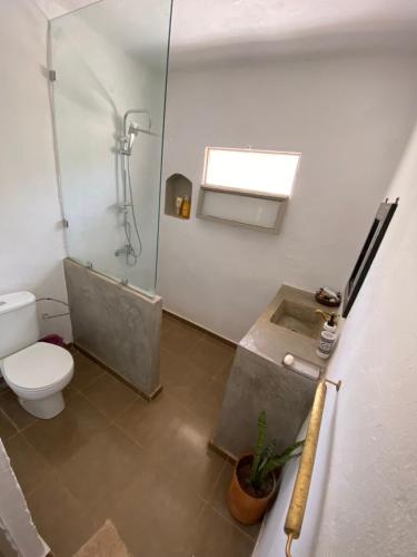 a bathroom with a shower and a toilet and a sink at Le village des oliviers in Fez