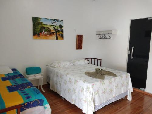 A bed or beds in a room at Pousada Solar Encanto do Marajó