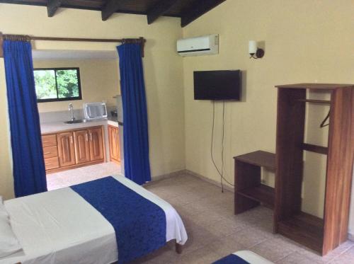 Katil atau katil-katil dalam bilik di Confort Arenal