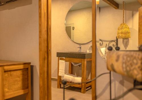 a bathroom with a sink and a mirror at Casa Lavanda Hotel Boutique in Pátzcuaro