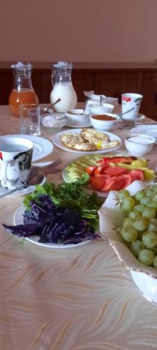 a table with plates of food on a table at Anna Home B&B in Areni
