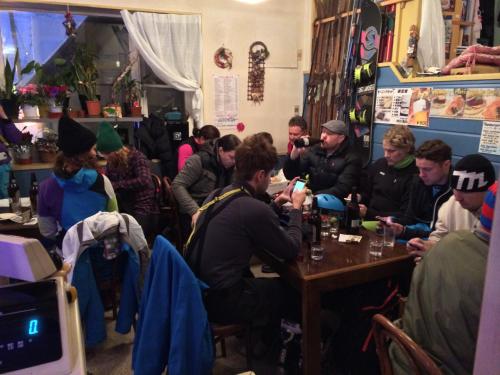 a group of people sitting at a table in a room at Hotel Senke in Myoko