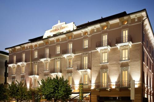 a building with a sign on top of it at Hotel Internazionale Bellinzona in Bellinzona