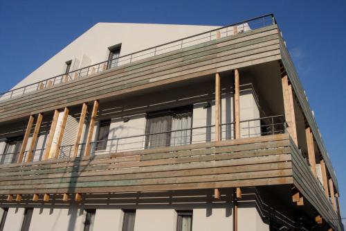 a building with a balcony on the side of it at Aura Boutique in Lixouri