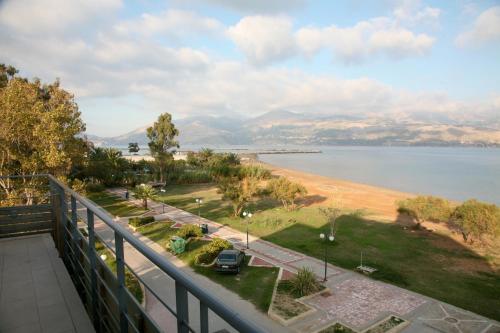 a balcony with a view of a body of water at Aura Boutique in Lixouri